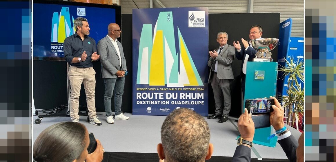 Camille Pélage, vice-président du conseil régional (2e à gauche), assiste au dévoilement de l’affiche de la Route du rhum – destination Guadeloupe 2026 à Saint-Malo le 25 avril. Photo : Région Guadeloupe Camille Pélage, vice-président du conseil régional (2e à gauche), assiste au dévoilement de l’affiche de la Route du rhum – destination Guadeloupe 2026 à Saint-Malo le 25 avril. Photo : Région Guadeloupe